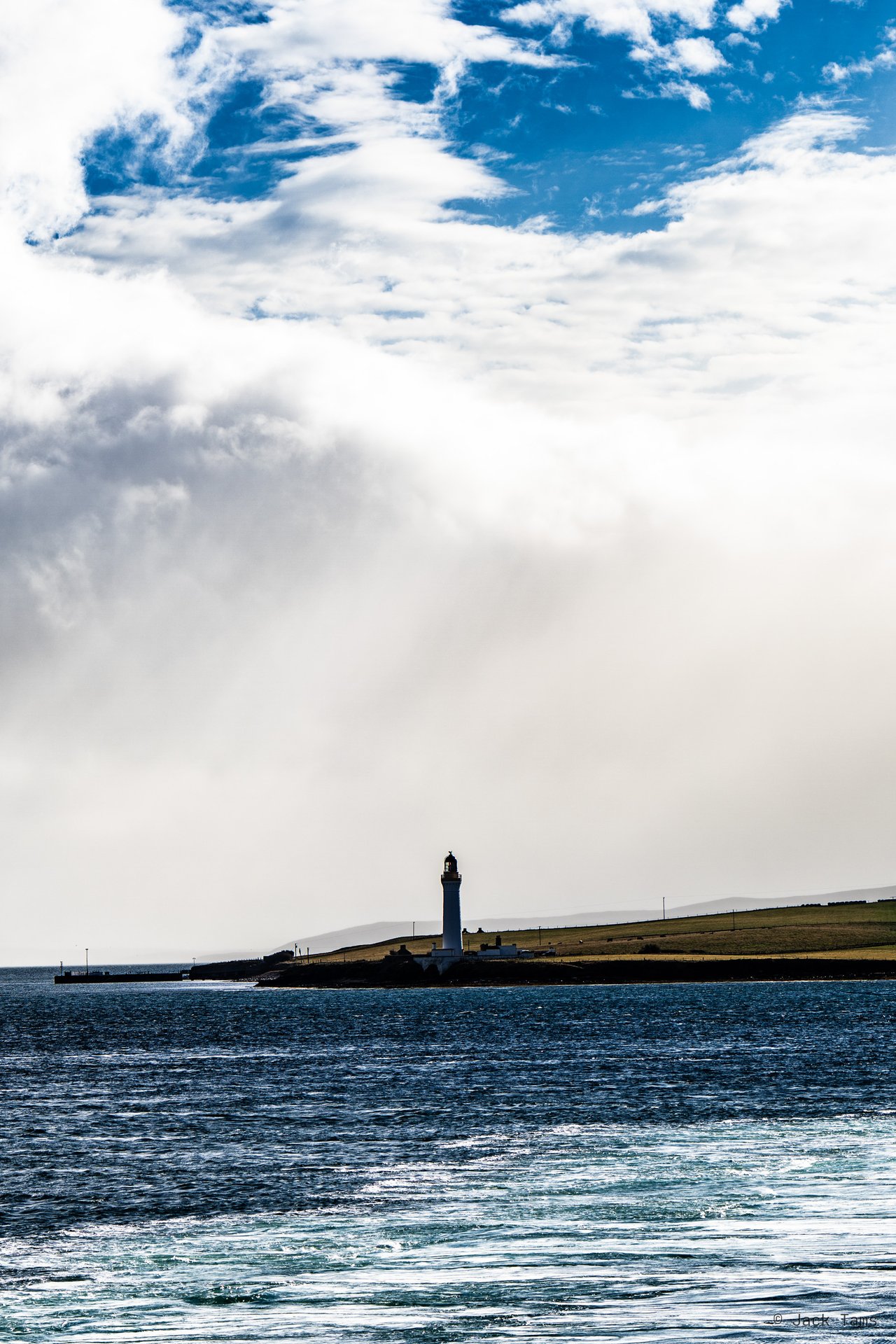 A lighthouse on Graemsay, coming into Stromness.