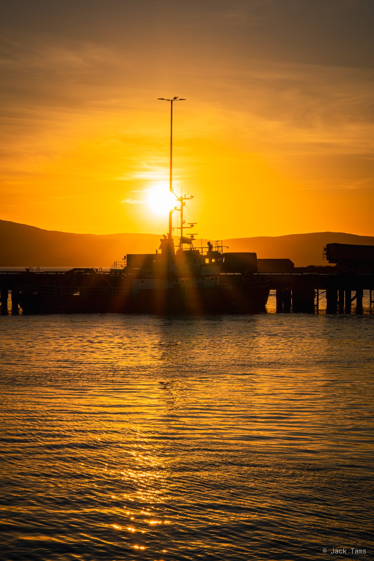 Sunrise over the harbour at Stromness.