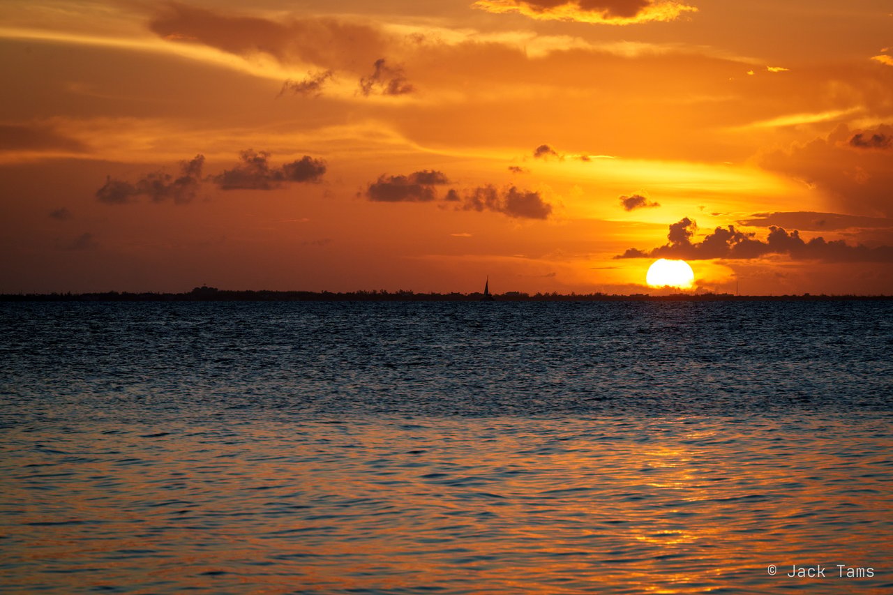 The sun going down over the sea.