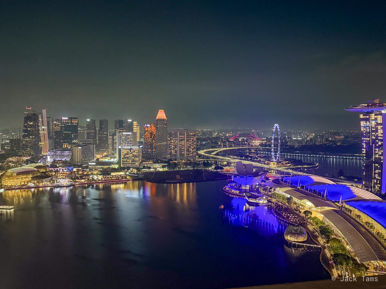 Marina Bay lit up at night.