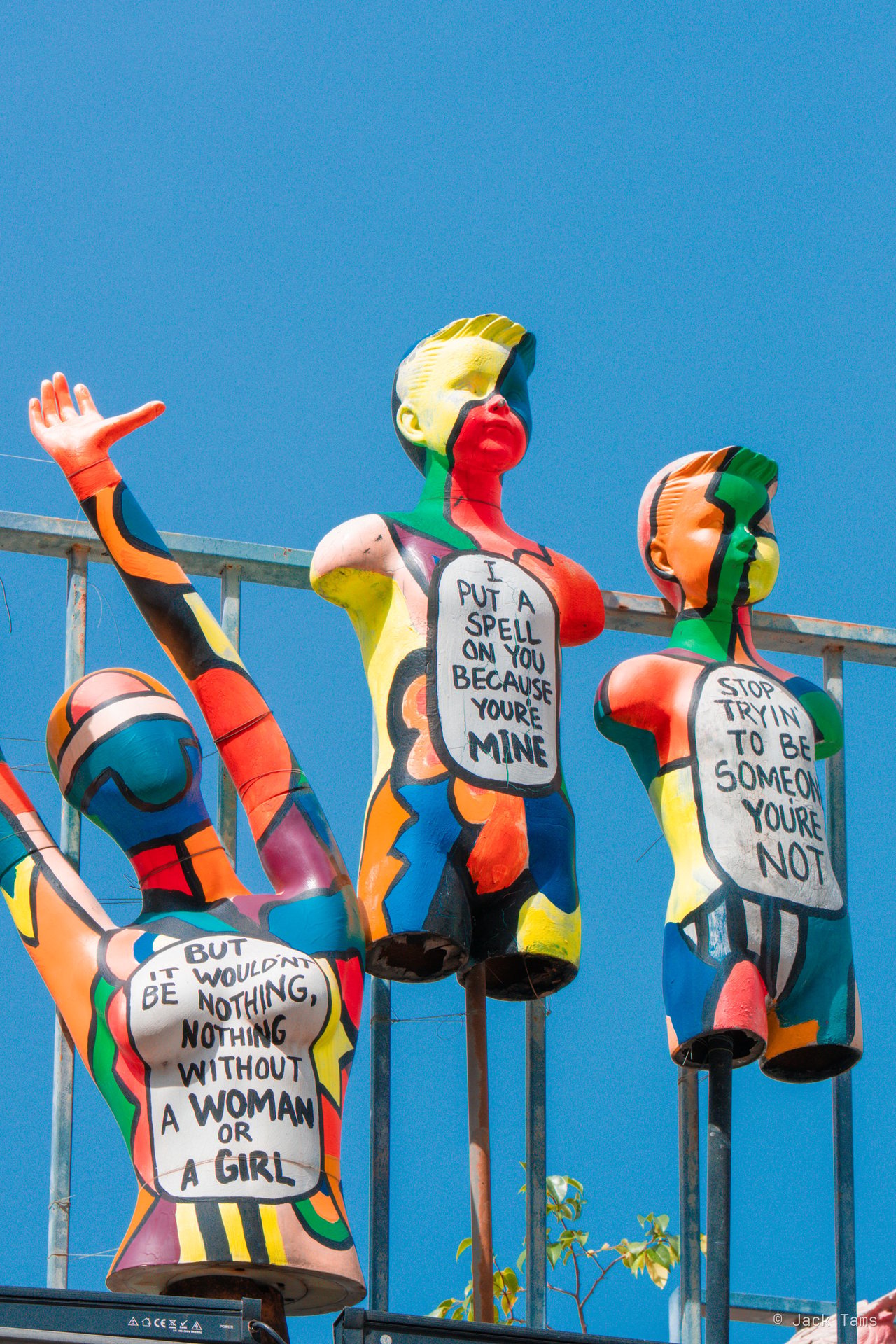 Painted figures on a rooftop in Kampong Glam.