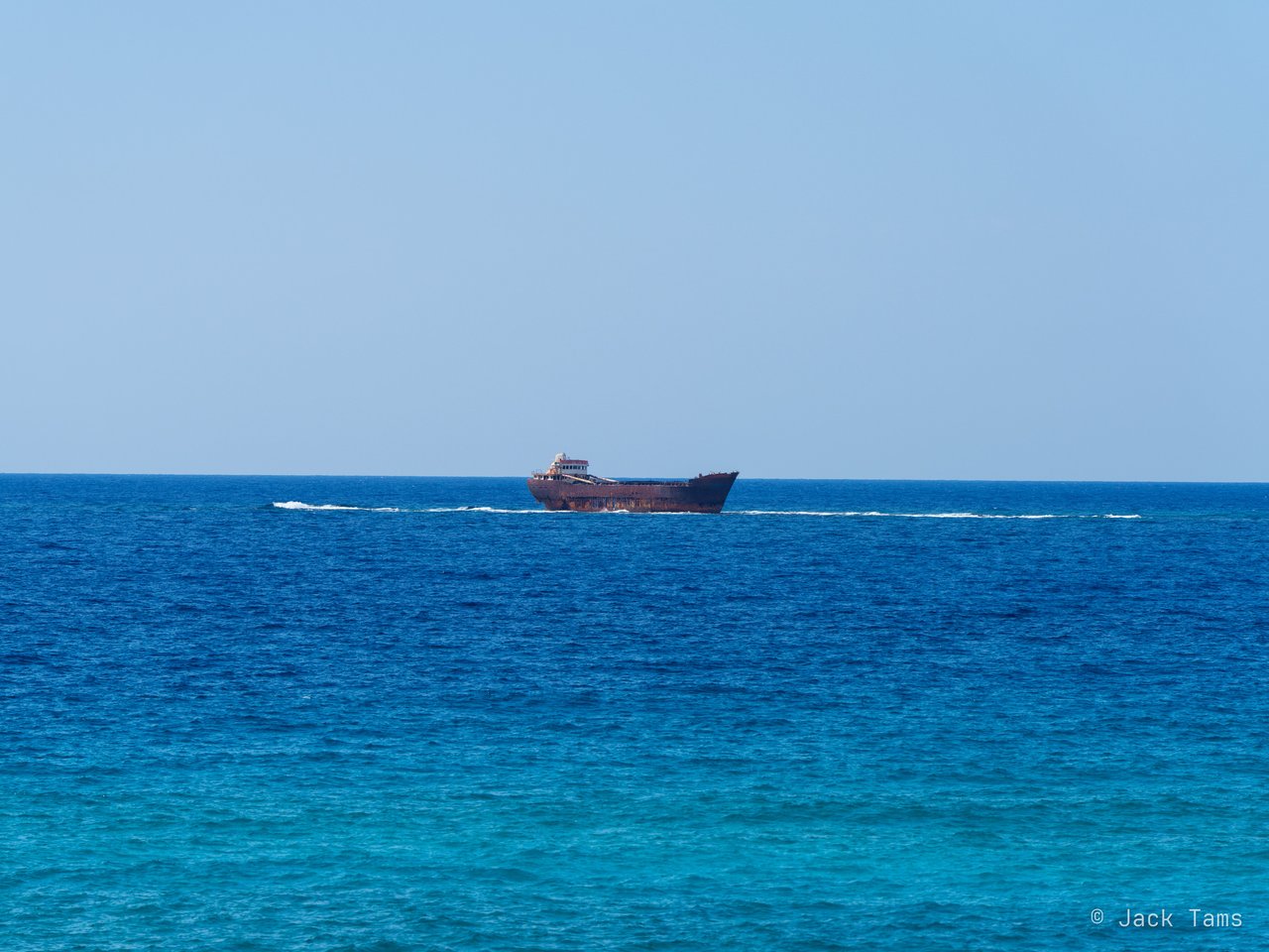 The Edro III, the cargo ship that ran aground off the coast near Paphos in 2011, across the deep blue water.
