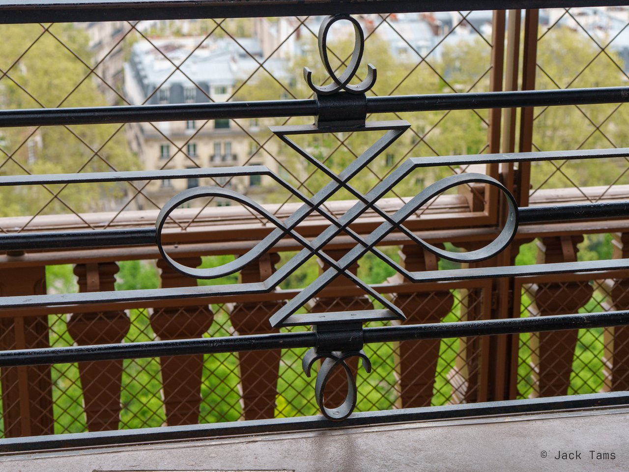 The city through the tower's railings.