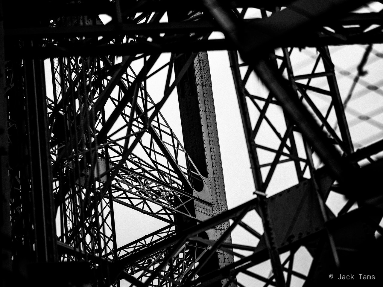 The tower's ironwork in black and white.