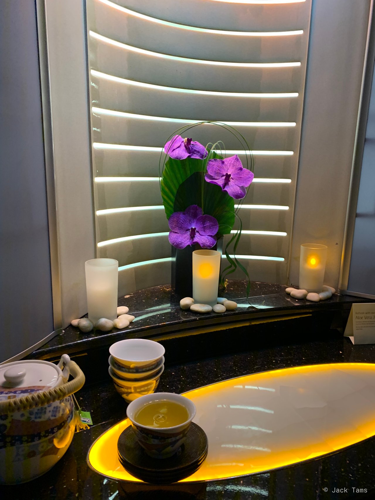 Orchids and candles between the two shower spas, at the front of the upper deck.