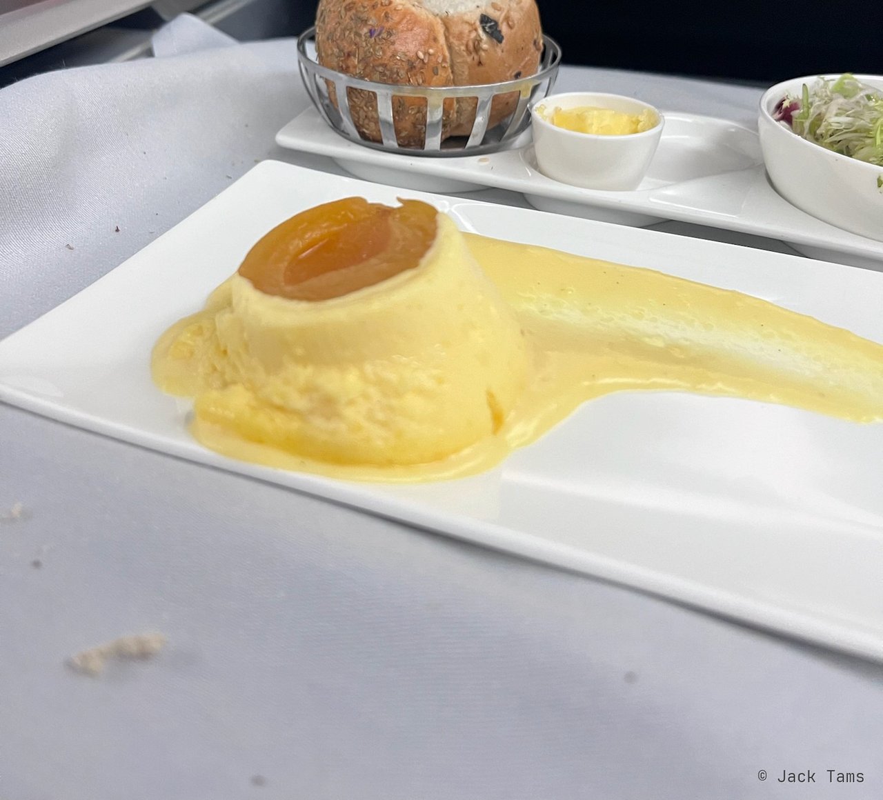 Apricot soufflé with vanilla custard.