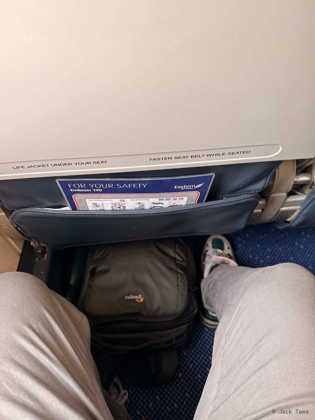Legroom in 3A, with Eastern Airways' safety card in the seat pocket.