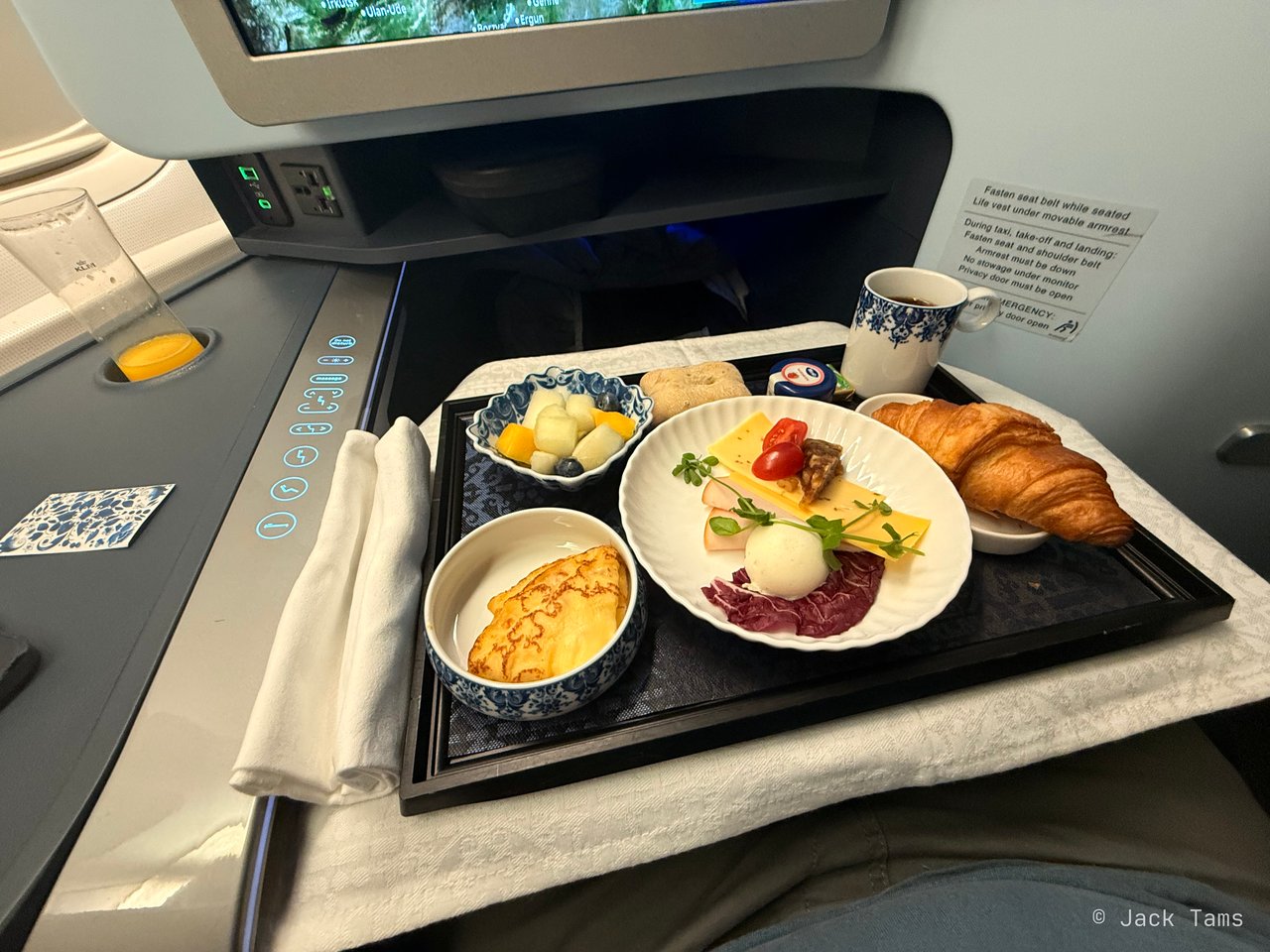 Fruit salad, the cold plate, a pancake with quark and apricot, and a croissant.