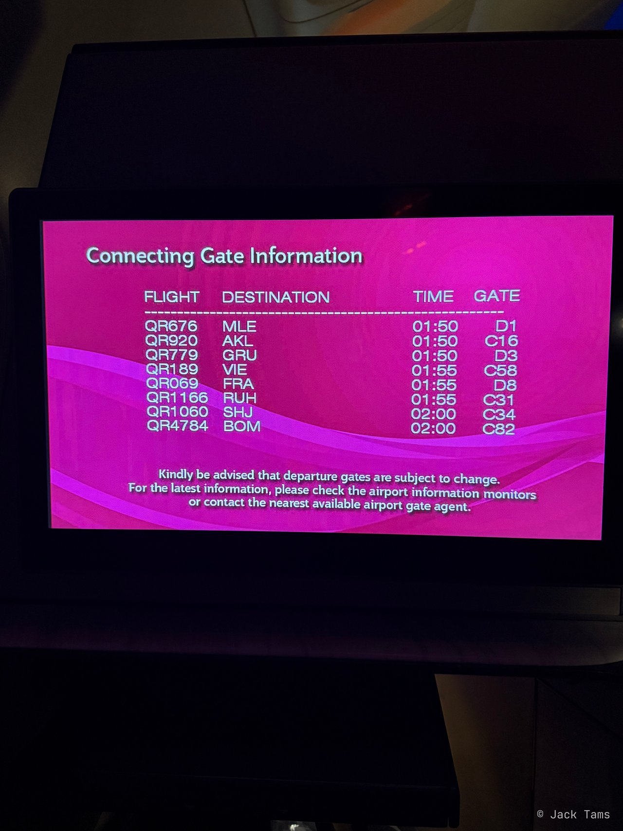 The connecting-gate screen before landing in Doha.