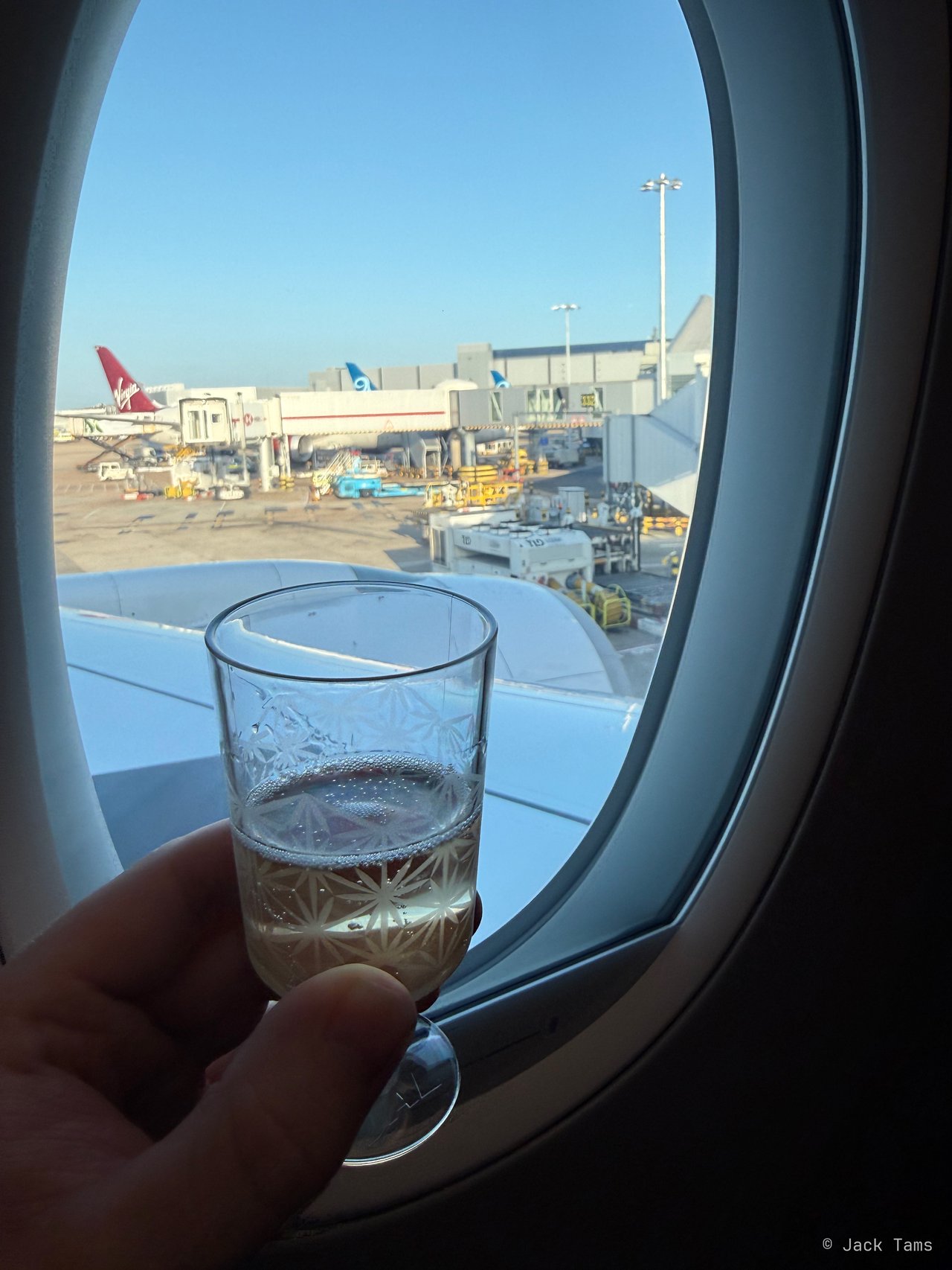 A drink at the window before pushback.