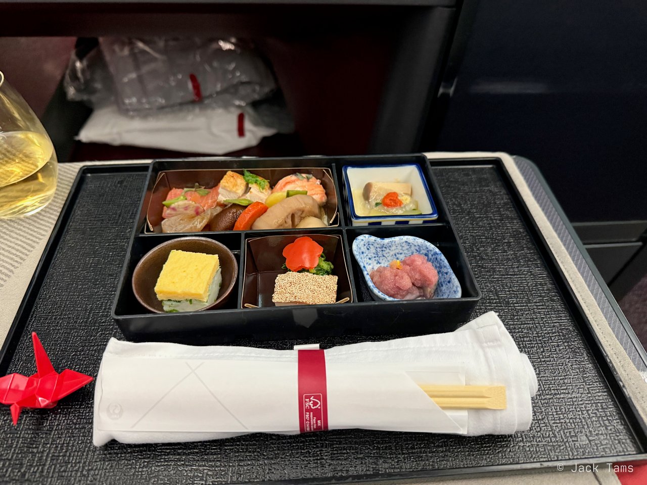 Clockwise from the top left: soy-simmered vegetables with lobster, smoked salmon and roasted chicken; courgette and king oyster mushroom with crab sauce; simmered abalone with grated candy cane beet; a shrimp cake; and an egg cake sand.