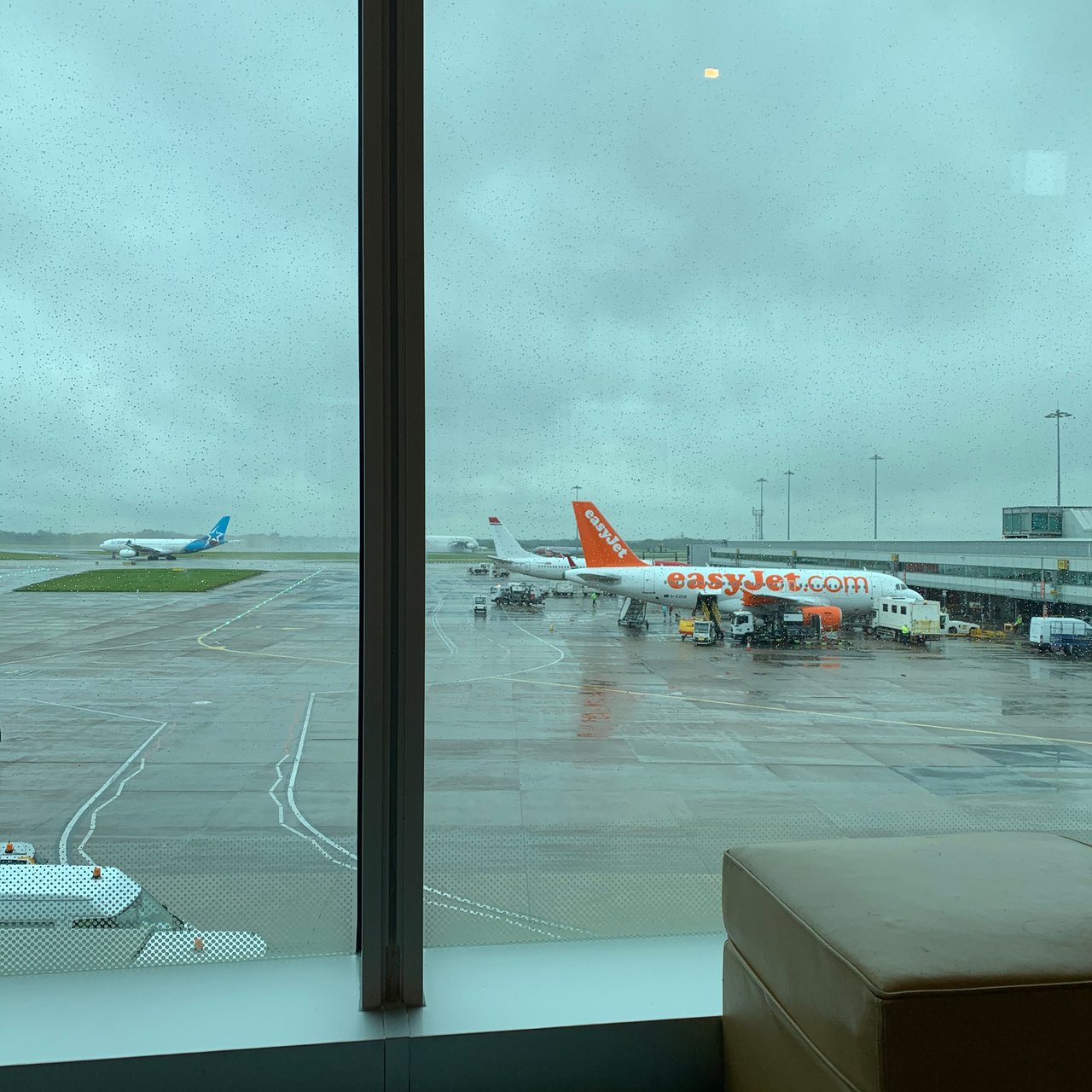 Rain on the lounge glass, looking out over the apron.