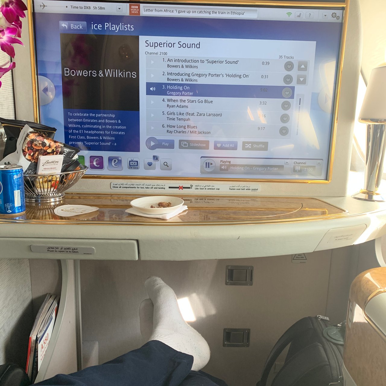 Feet up in front of the screen.