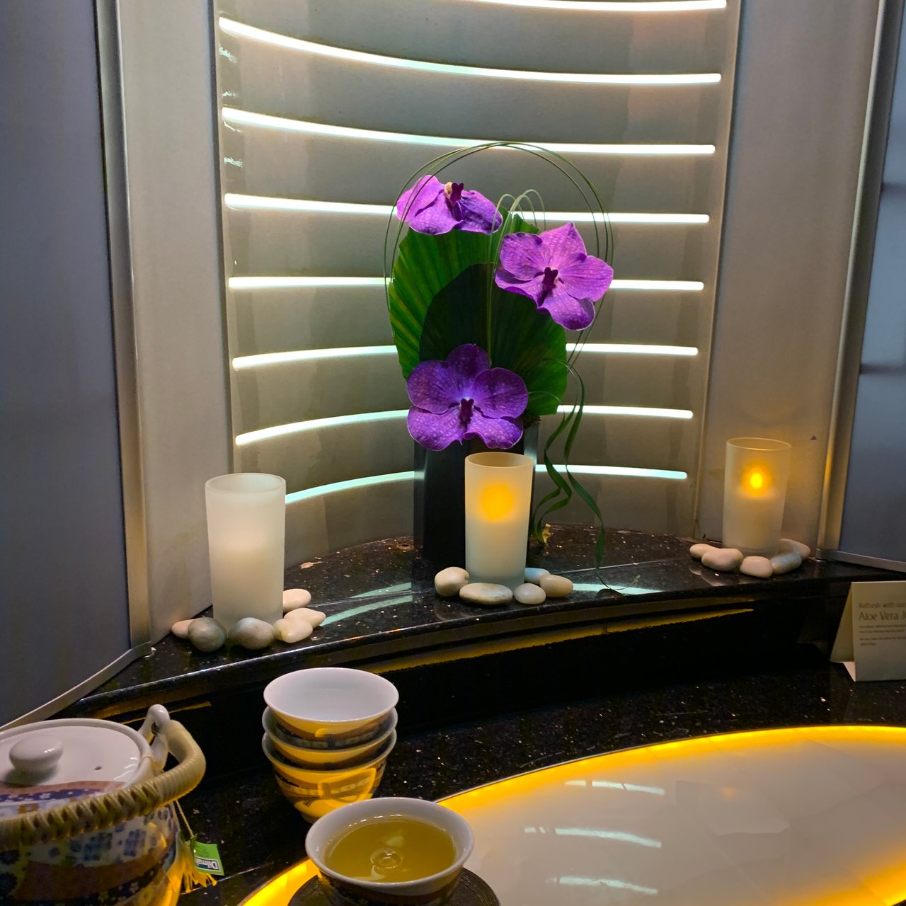 Orchids and candles between the two shower spas, at the front of the upper deck.