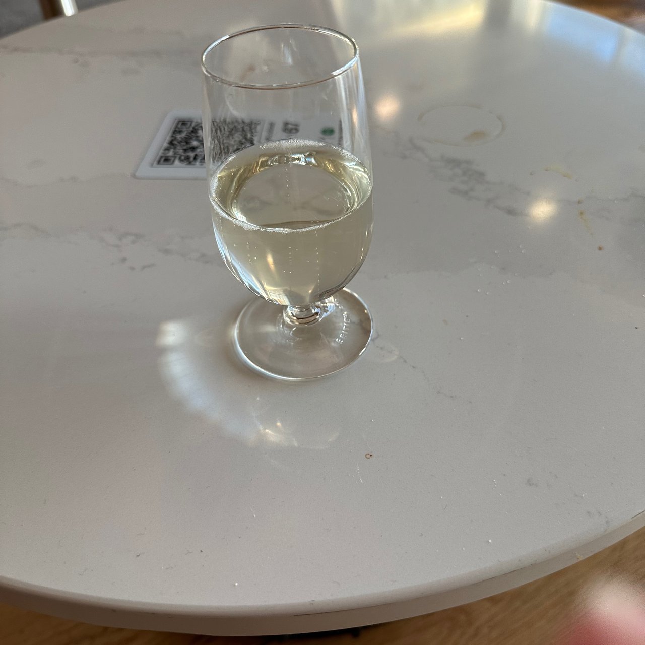 A glass of white in the lounge at Terminal 5.