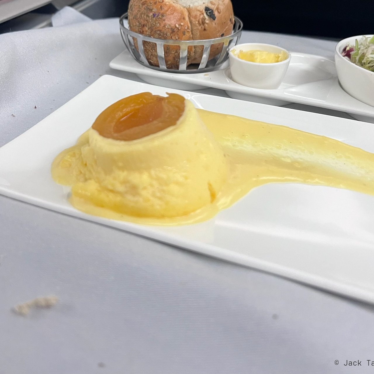 Apricot soufflé with vanilla custard.