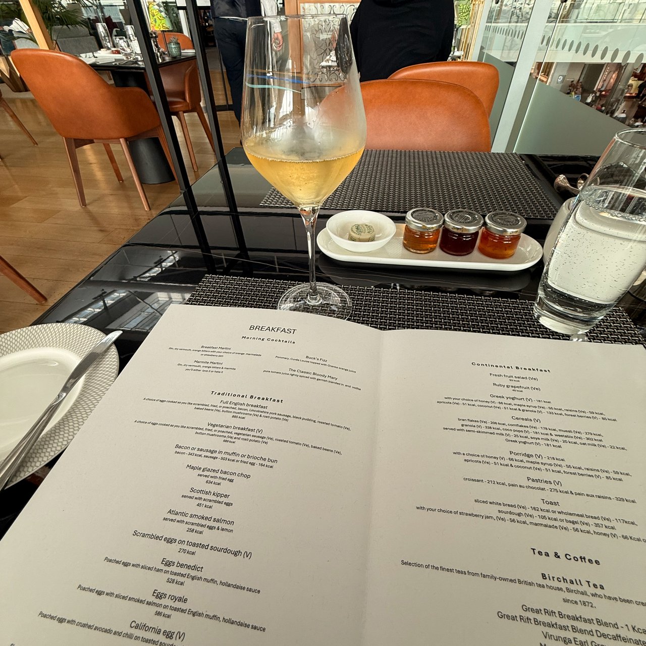 A glass of wine and the lounge menu.