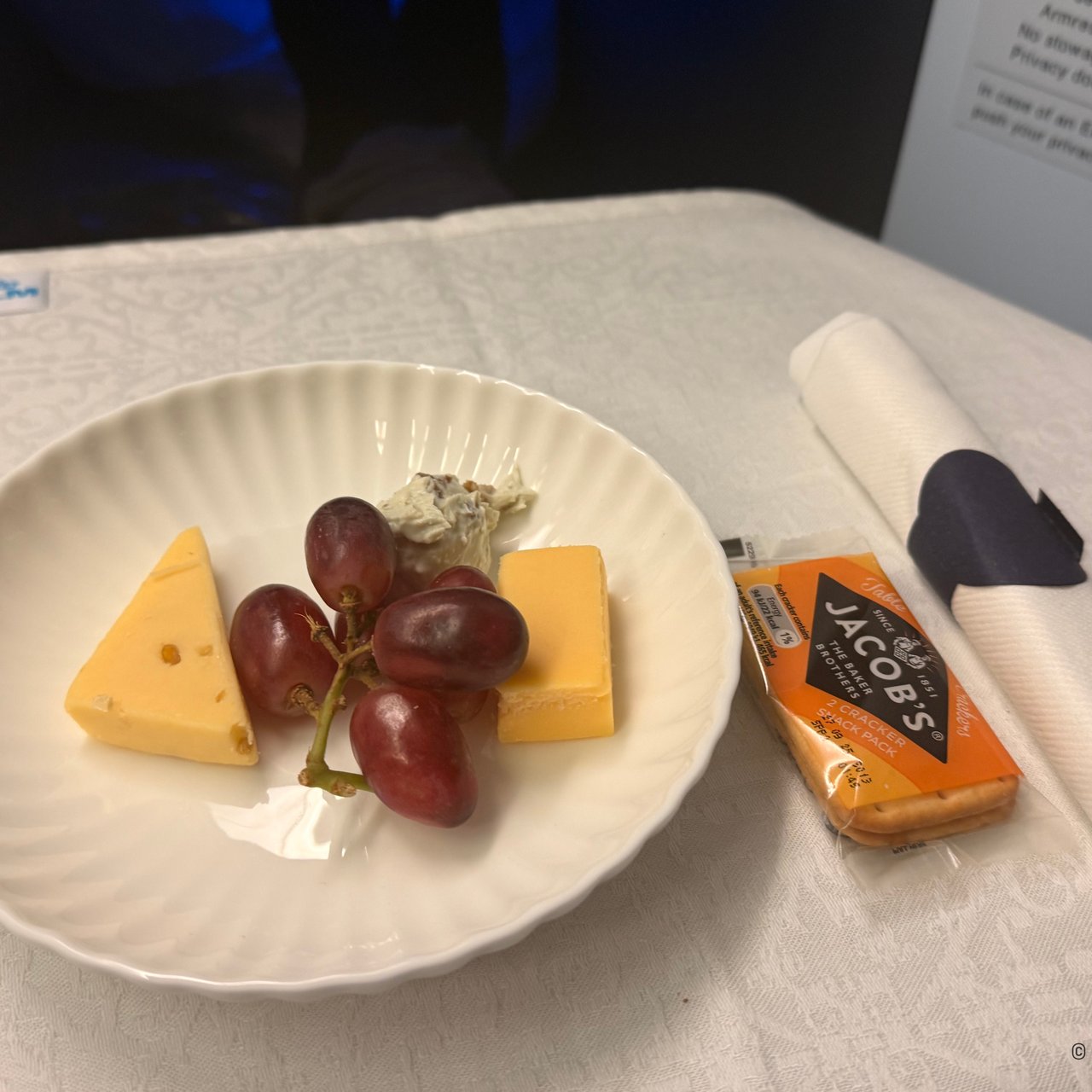 Beemster Royal, fenugreek cheese and blue cheese, with grapes and crackers.