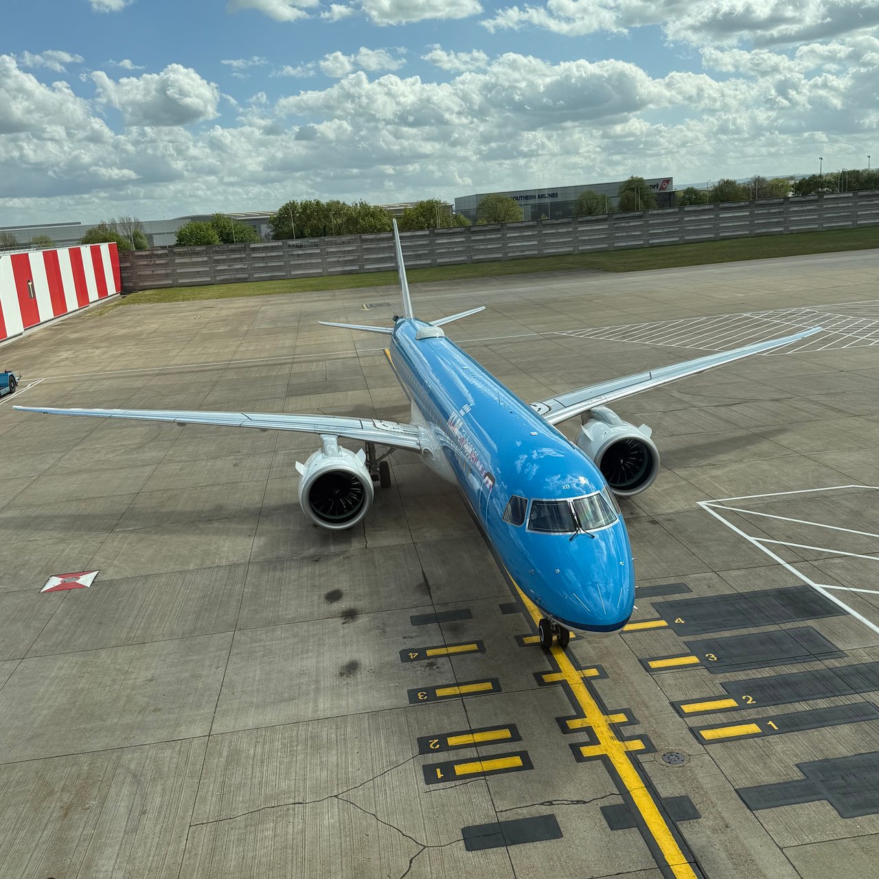 A KLM Cityhopper Embraer E195-E2 coming onto its stand.