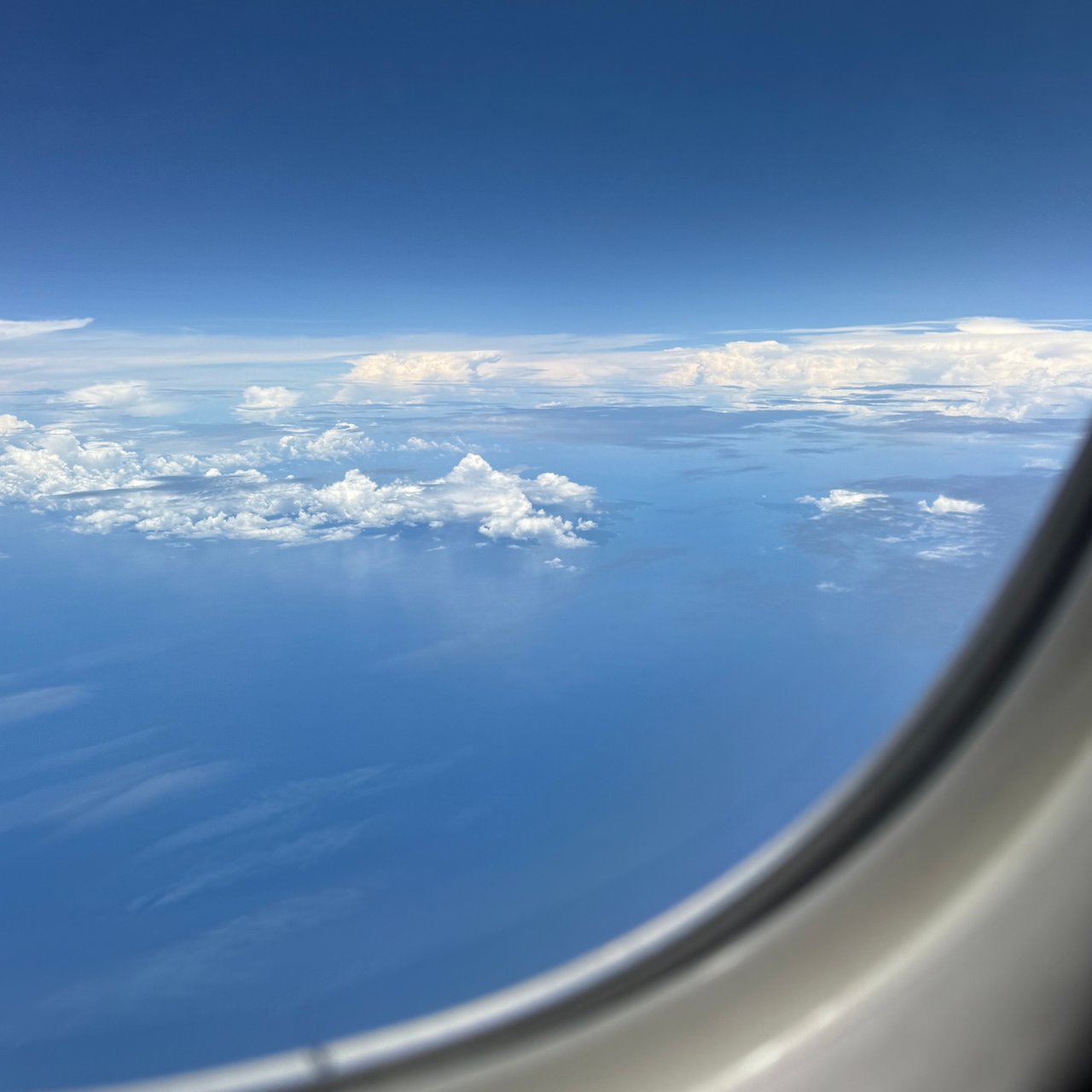 Blue sky and scattered cloud on the way to Singapore.