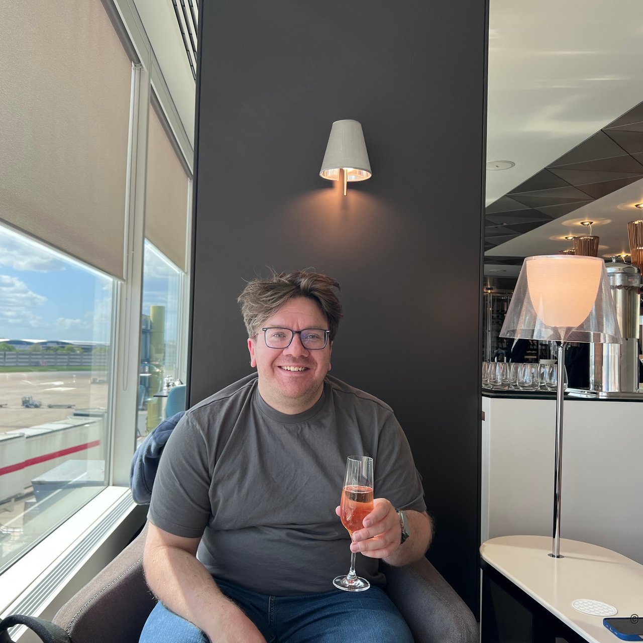 Fizz by the window in Qatar's lounge at Terminal 4.