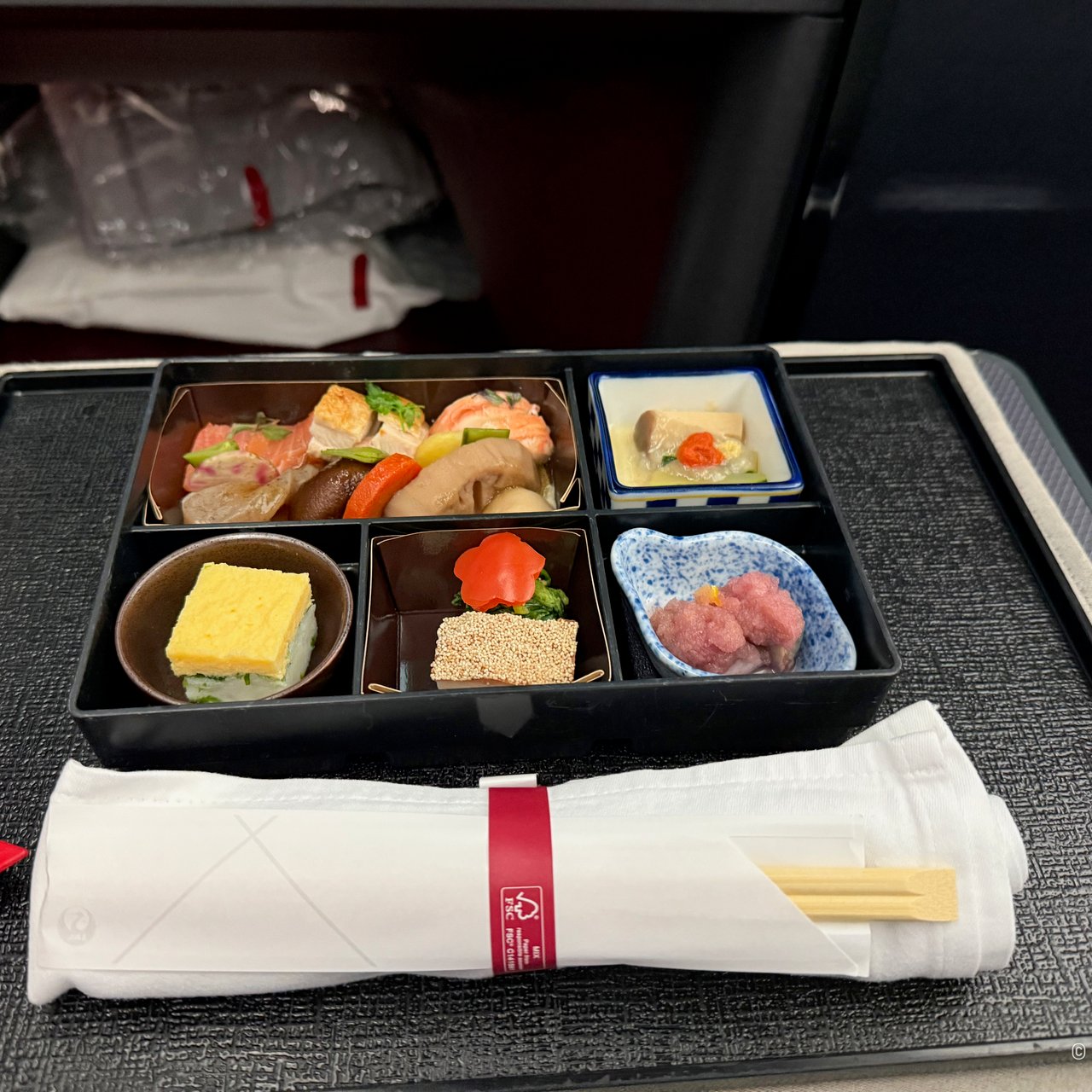 Clockwise from the top left: soy-simmered vegetables with lobster, smoked salmon and roasted chicken; courgette and king oyster mushroom with crab sauce; simmered abalone with grated candy cane beet; a shrimp cake; and an egg cake sand.